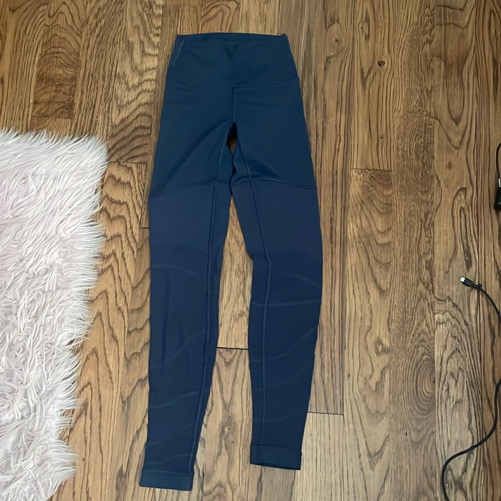 Purple Lululemon Leggings. Mesh at bottom.